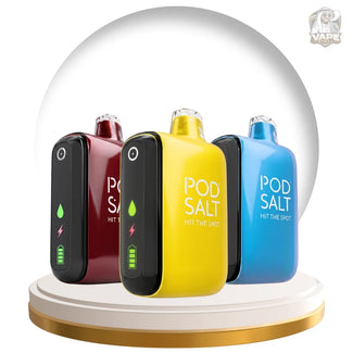 Four Pod Salt vape devices in black, burgundy, yellow, and blue, arranged on a white and gold circular pedestal inside a clear glass dome. The center yellow device is in front and displays the text 'POD SALT HIT THE HOT'.