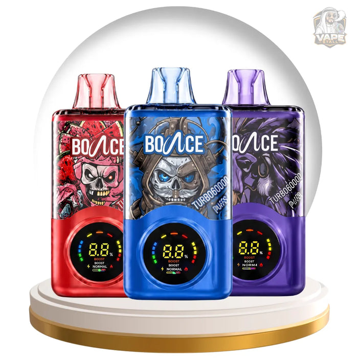 Three BO:ACE disposable vape devices in red, blue, and purple colors, displayed side-by-side on a gold-rimmed white platform inside a clear glass dome. Each device features a different skull graphic design and a digital display screen.