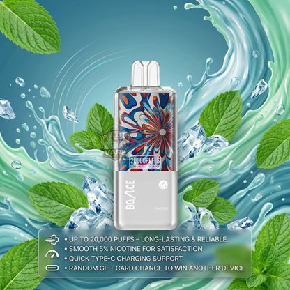 A BO/ICE ZHDOOQUE 3 disposable vape device with a colorful floral pattern and silver body, set against a dynamic background of mint leaves, ice cubes, and green liquid splashes. A feature list overlay is at the bottom.