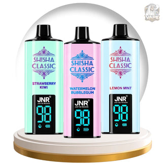 Three JNR Shisha Classic disposable vape devices in mint green, pink, and light blue, displayed side-by-side on a white and gold circular pedestal.