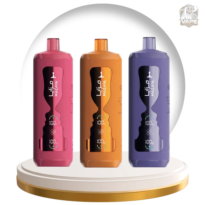Three MAZAYA vape devices in pink, orange, and purple, displayed side-by-side on a white and gold circular pedestal against a white background with a subtle gray arch.