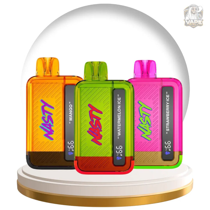 Three NASTY disposable vape devices in translucent orange, green, and pink colors, displayed inside a clear glass snow globe on a white and gold pedestal. The center green vape is in front, with 'NASTY' written on its side.