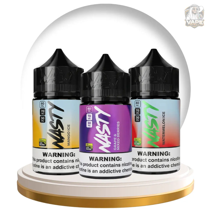 Three bottles of Nasty e-liquid displayed side by side under a clear dome on a white and gold circular pedestal. The bottles are labeled Mango Ice, Mixed Berries, and Watermelon Ice, with black caps and colorful gradient labels.