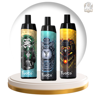 Three Yuoto disposable vape devices with custom graphic designs are displayed side-by-side on a white and gold circular pedestal. The left device features a green gorilla, the middle device features a silver and blue robot, and the right device features a black and yellow robotic owl.
